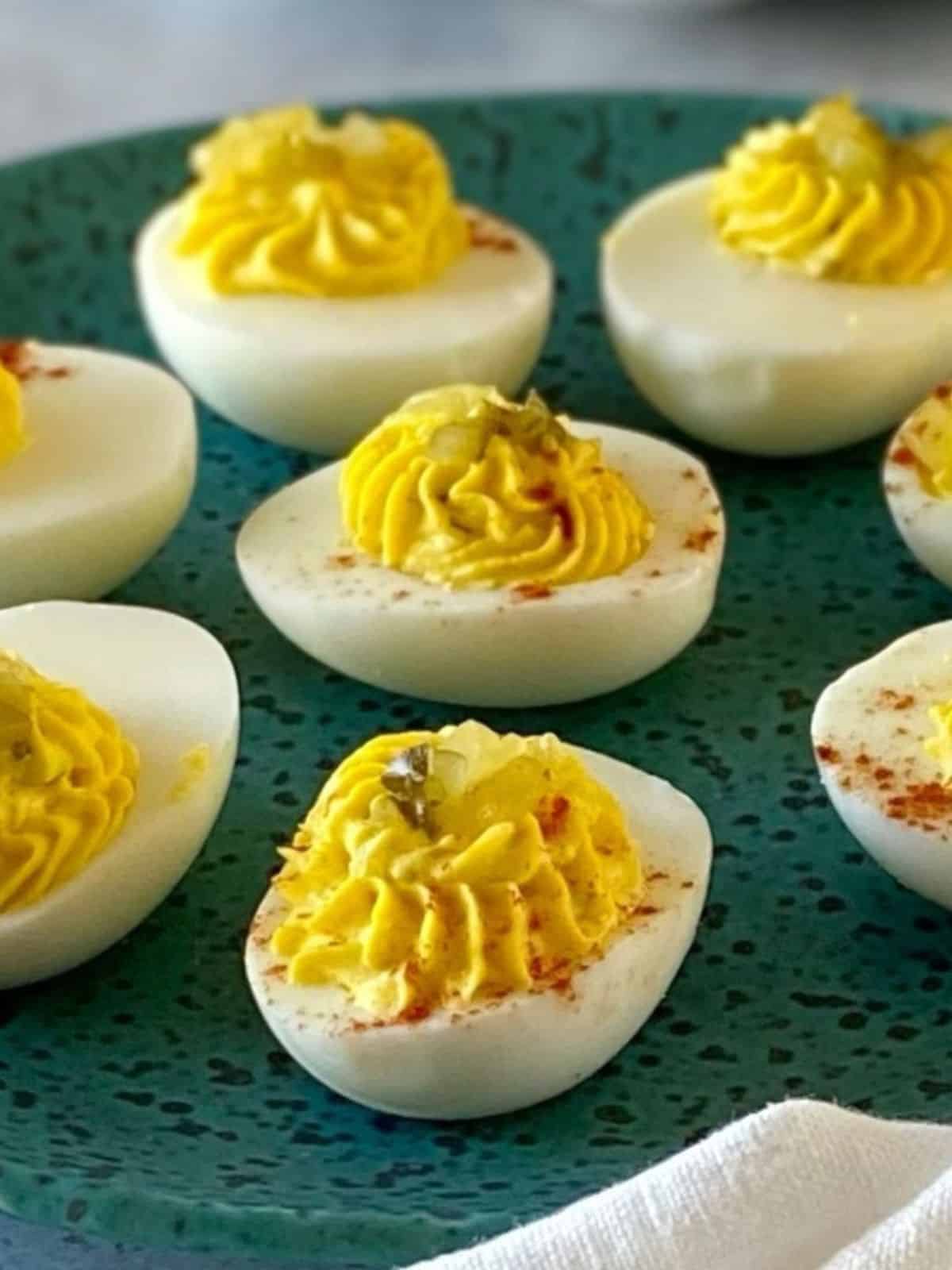 Deviled eggs on a serving plate.
