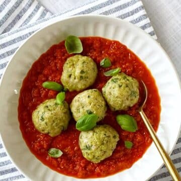 Meatballs and sauce in a bowl.