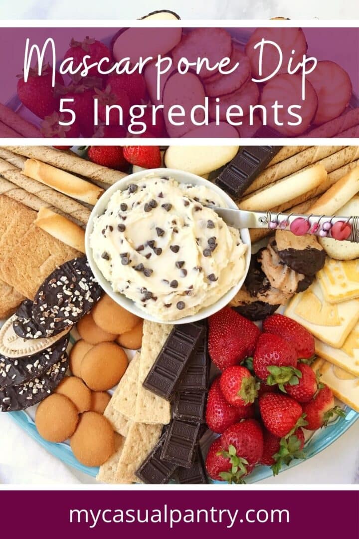 A platter with dip and a variety of cookies and fruit.