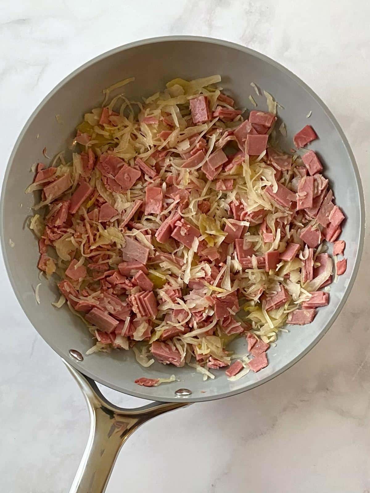 Corned beef and sauerkraut in a skillet.