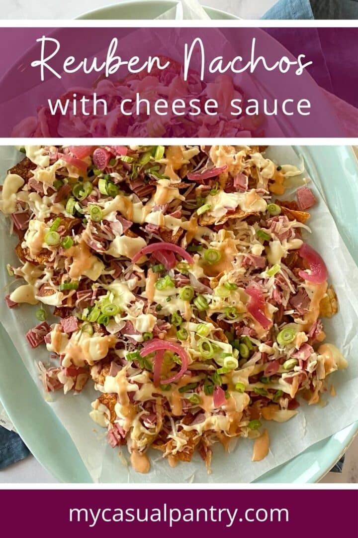 A platter of nachos topped with Reuben sandwich flavors.