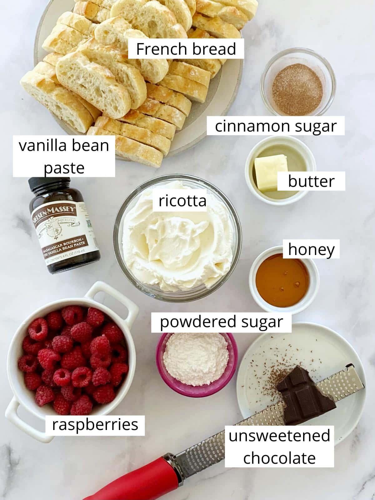 Ingredients for ricotta crostini with vanilla and raspberries.