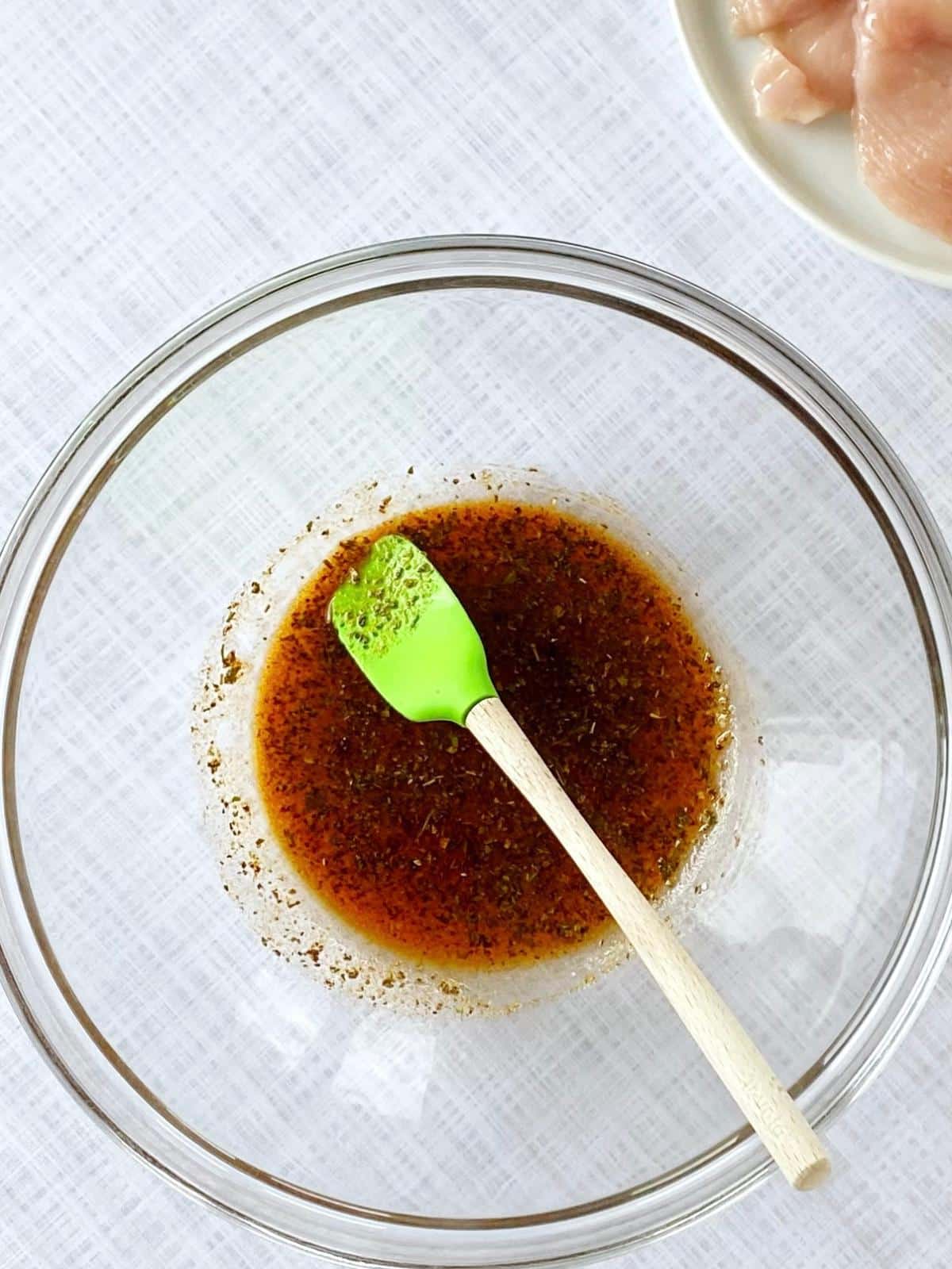 Oil and spices in a mixing bowl.