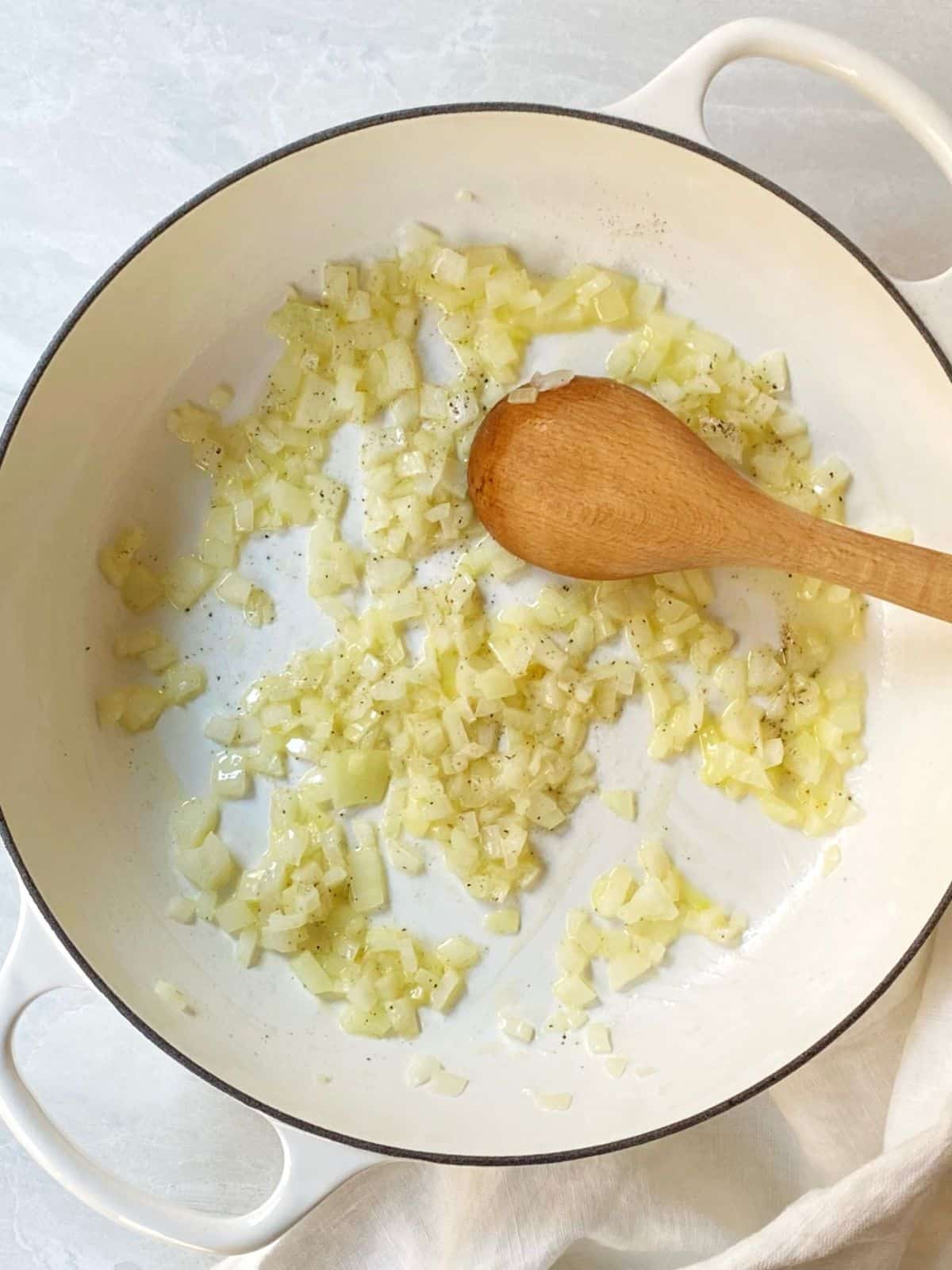Cooking onions in a skillet.