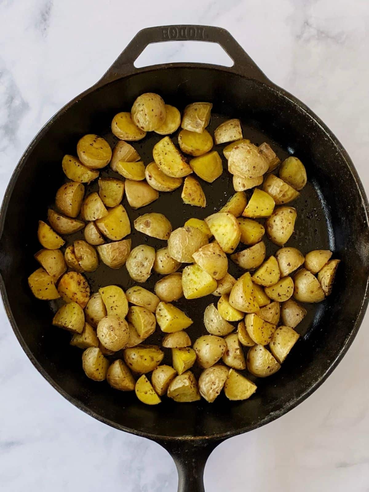 Roasted potatoes in a cast iron skillet.