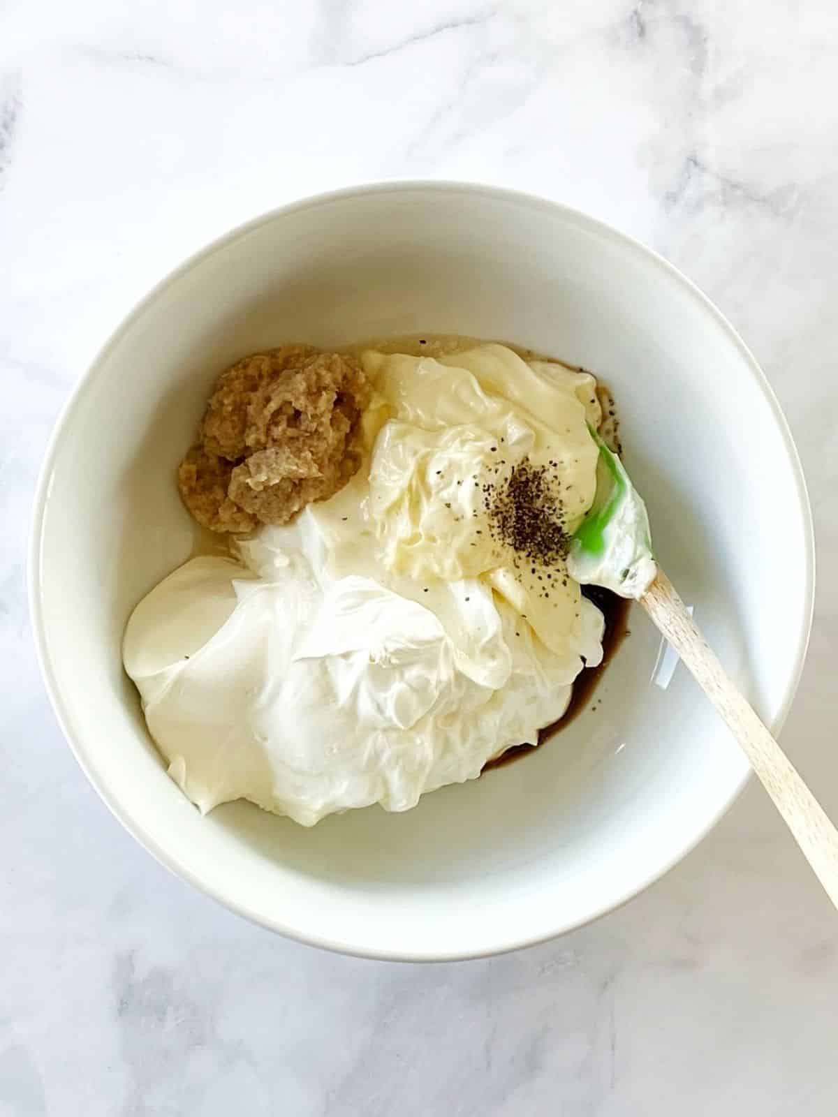 Mixing dip ingredients in a bowl.
