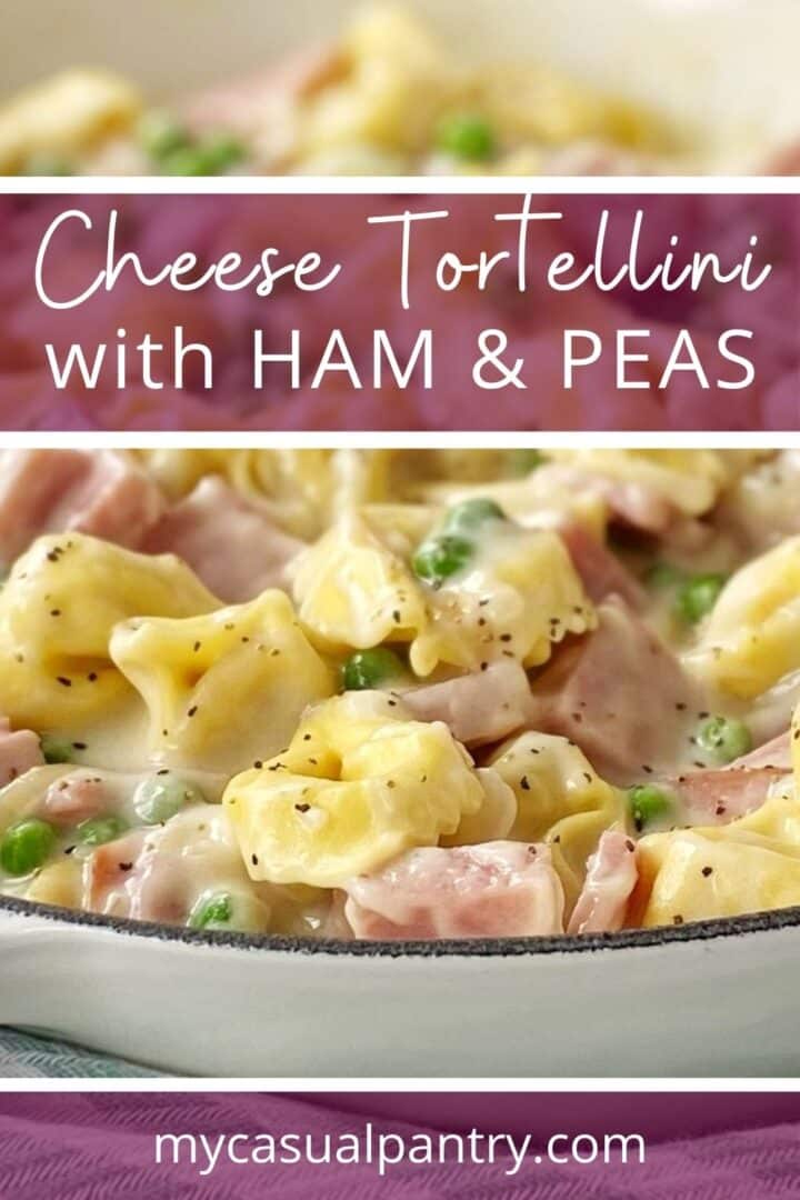 Skillet of creamy tortellini with ham and peas.