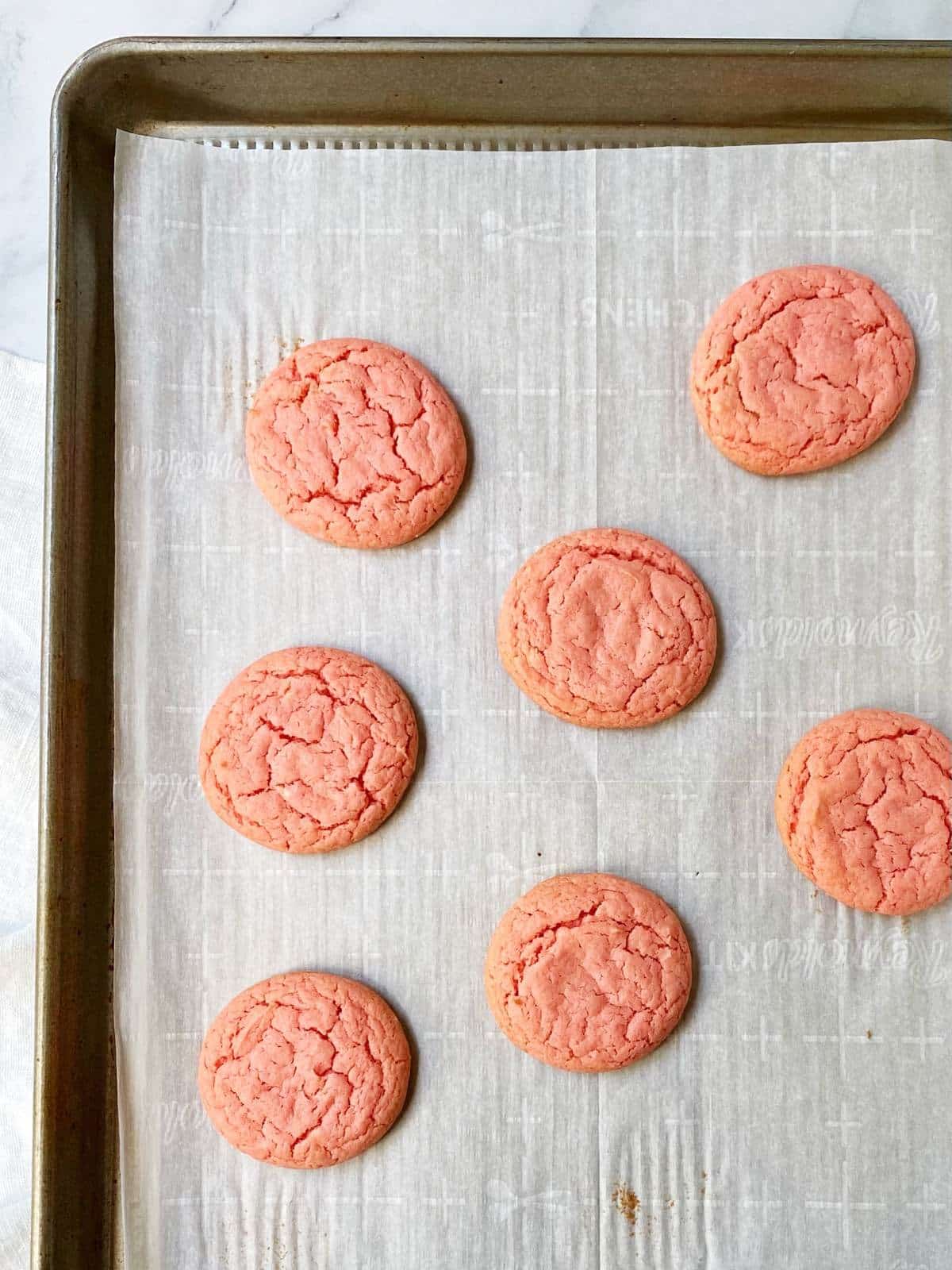 Baked cookies on a sheet pan.