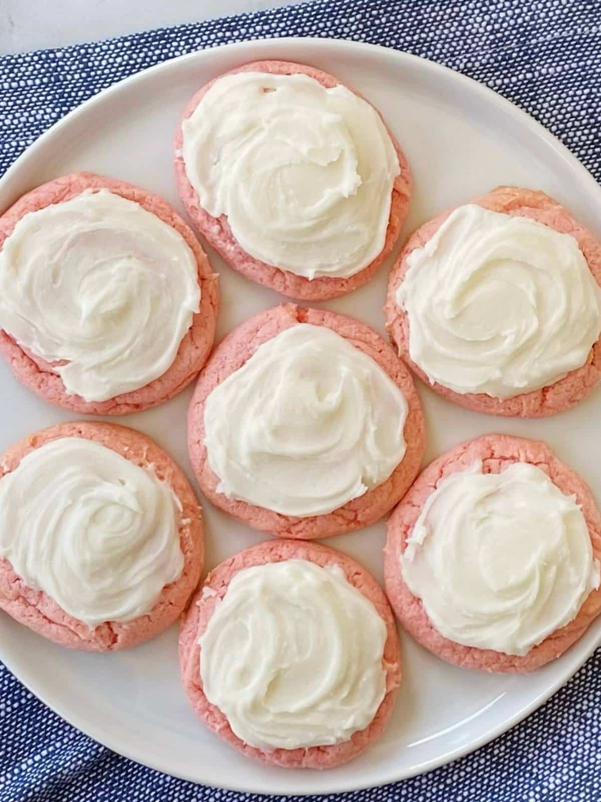 Frosted cookies on a plate.