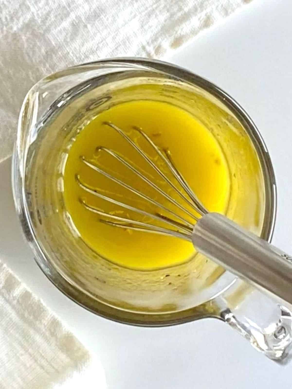 Vinaigrette in a glass pitcher.