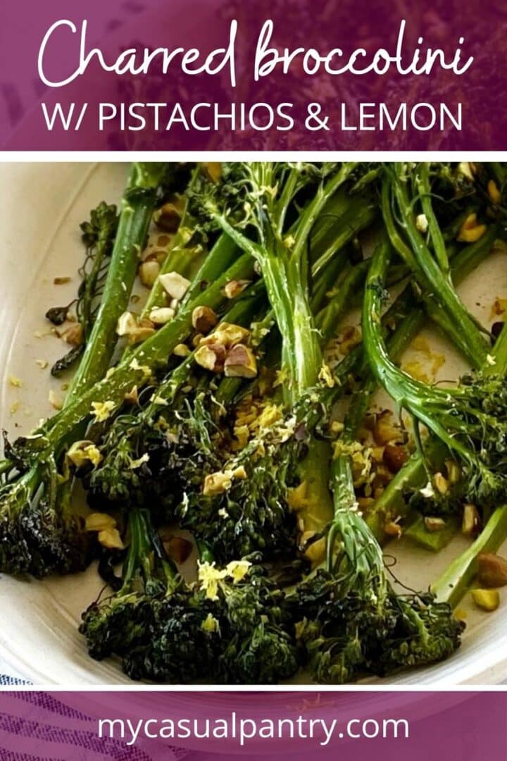 Broccolini with pistachios on a platter.
