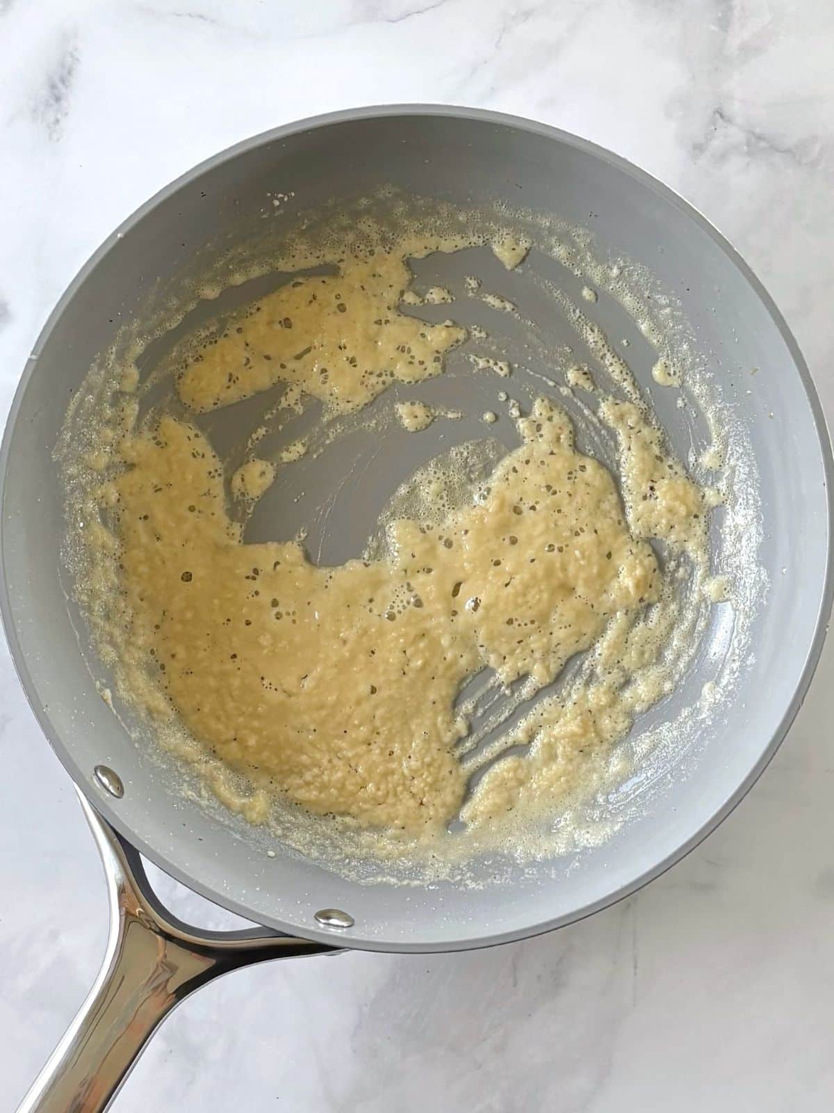 Cooking butter with flour in a skillet.