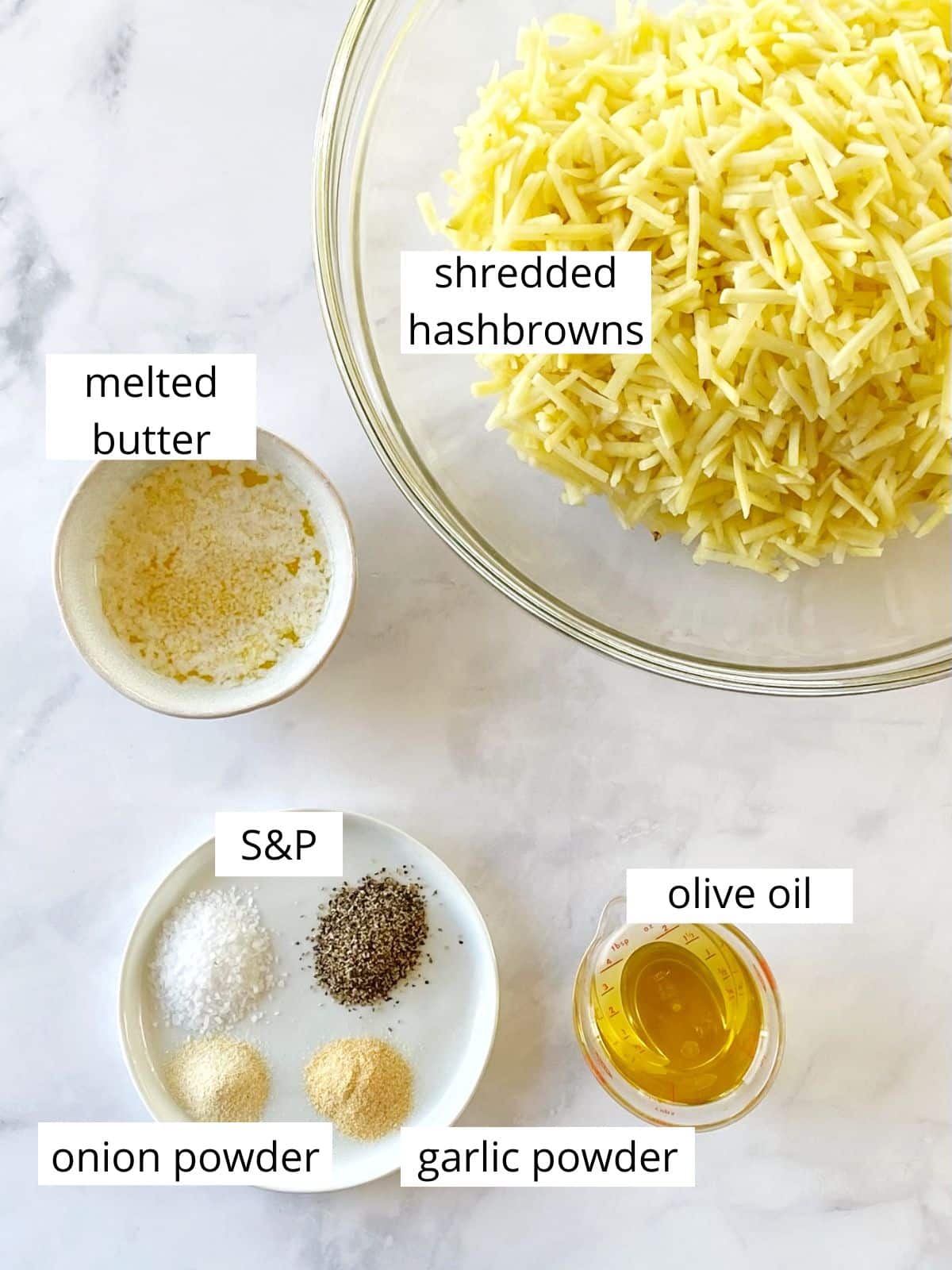 Ingredients for hash browns cooked in a skillet.