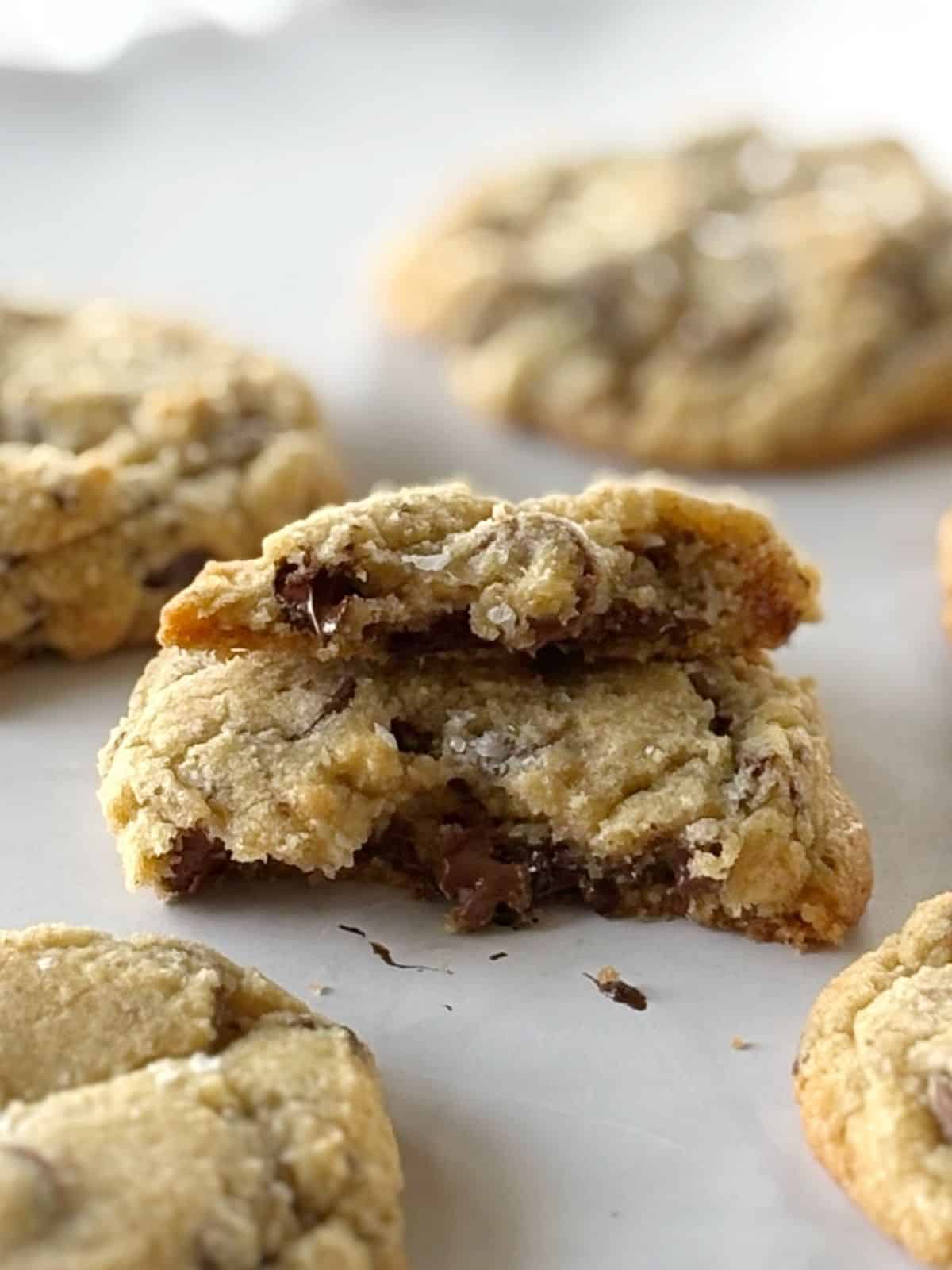 Cookie broken in half showing gooey center.
