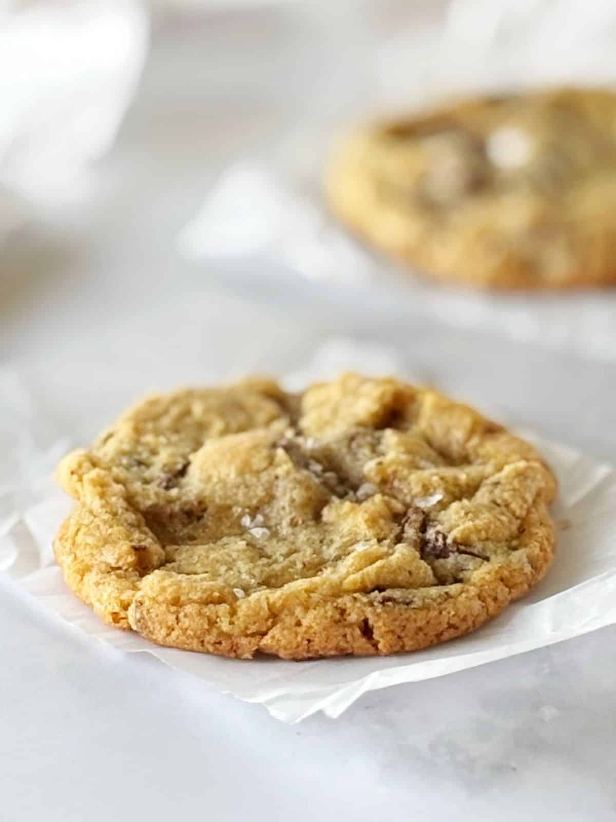 Baked cookie on a piece of parchment.