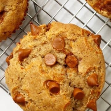 Cinnamon chip muffin on a cooling rack.