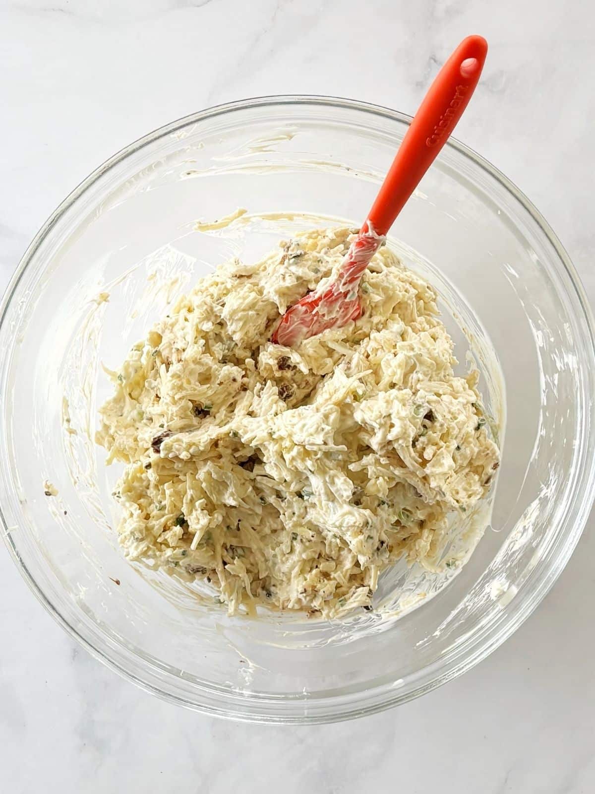 Sun-dried tomatoes, scallions, and chives mixed into the cheese mixuture.