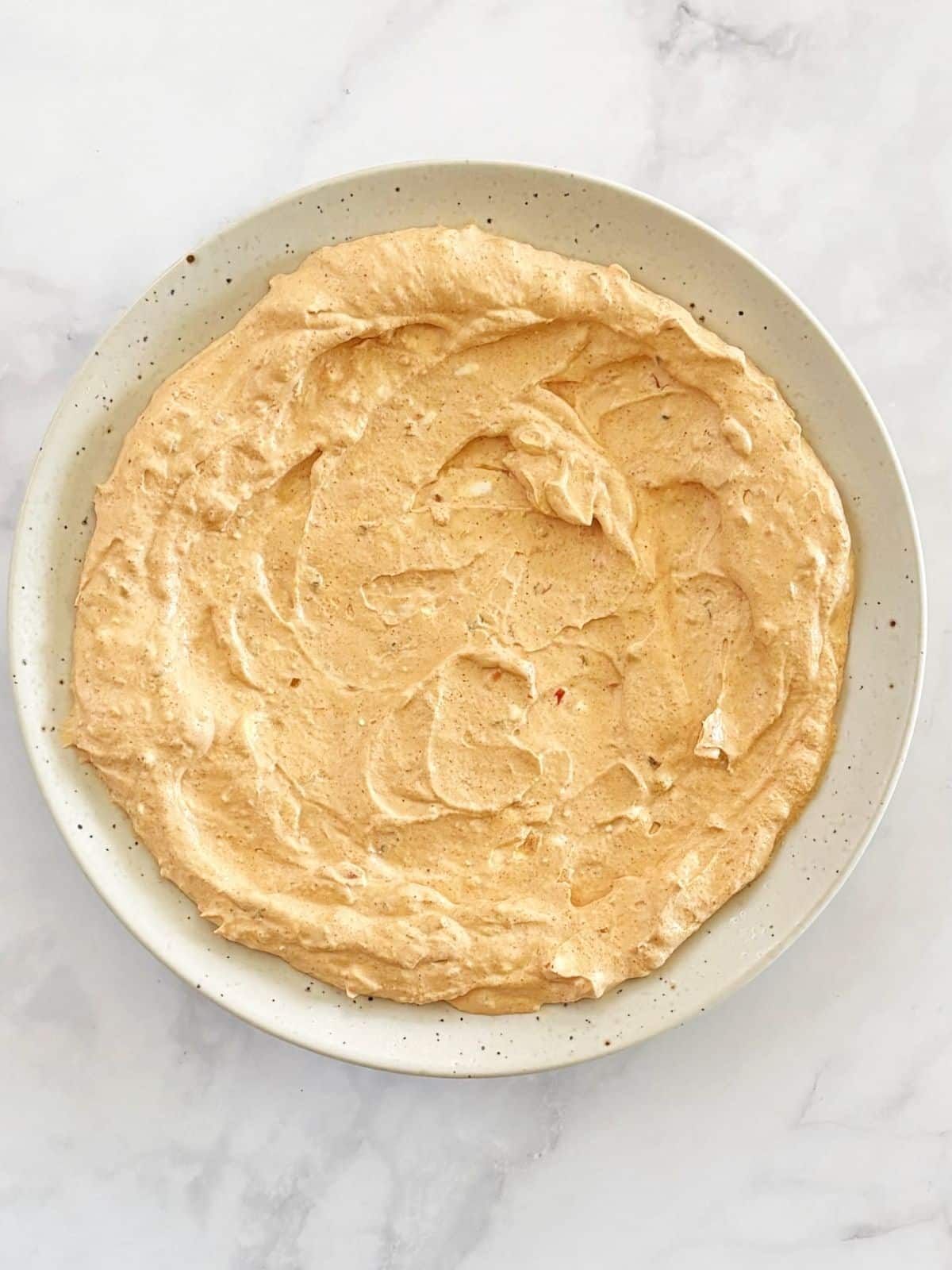 Dip mixture spread on a serving platter.