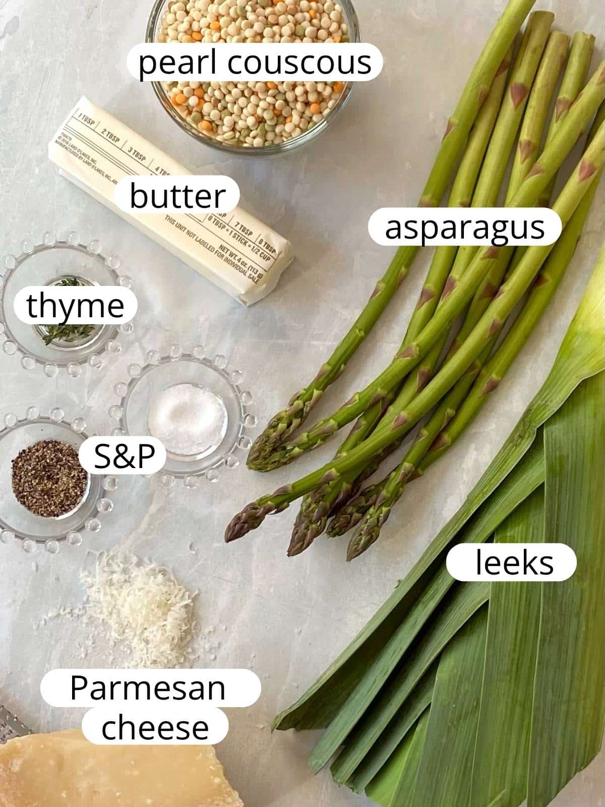 Ingredients for brown butter couscous with asparagus and leeks.