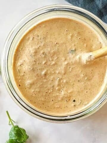 Salsa dressing in a glass jar.