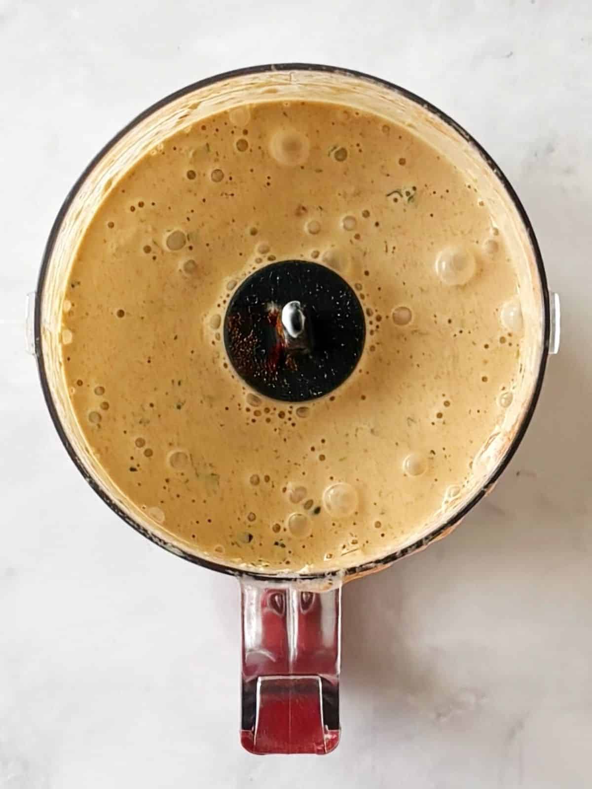 Dressing blended in food processor.
