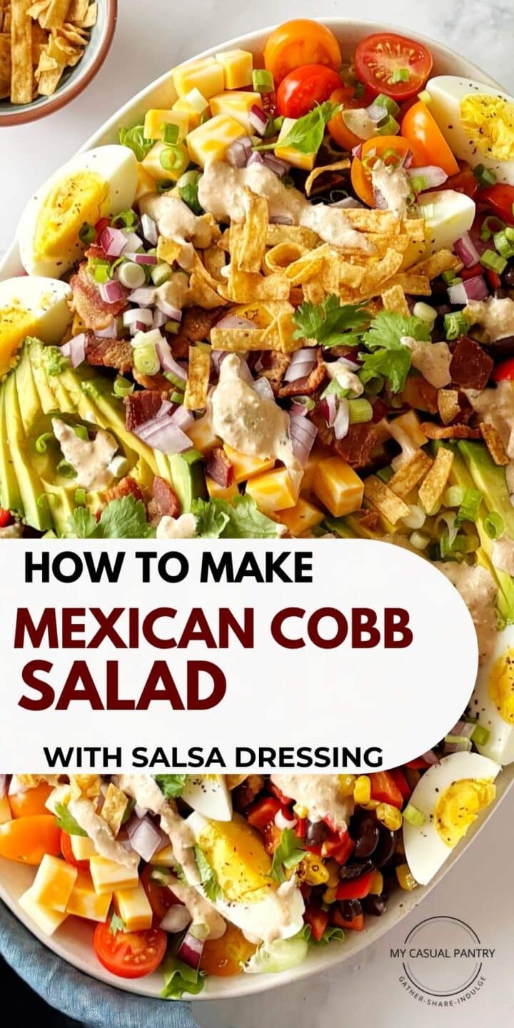 A platter of Mexican Cobb salad garnished with cilantro and tortilla chips.