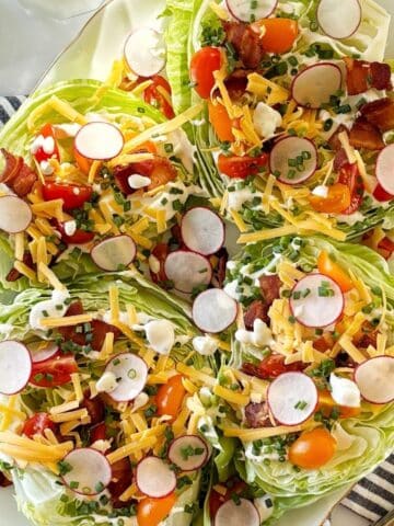 Loaded iceberg salad on a serving platter.