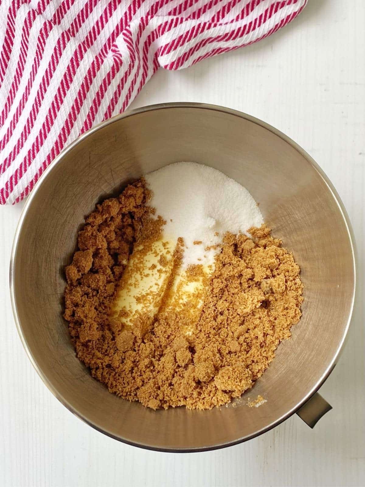 Butter, granulated sugar, and brown sugar in a mixing bowl.